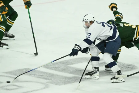Oct 10, 2025; University Park, PA, USA; Penn State Nittany Lions forward Gavin McKenna (72) skates past Clarkson Golden Knights defenseman Noah Houle (3) during the third period at Pegula Ice Arena.