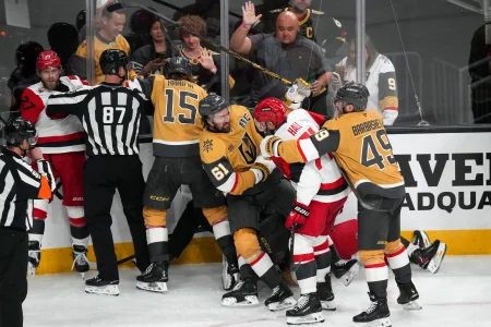 Jun 6, 2026; Las Vegas, Nevada, USA; The Vegas Golden Knights and the Carolina Hurricanes fight during the third period in game three of the 2026 Stanley Cup Final at T-Mobile Arena.