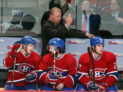 May 19, 2014; Montreal, Quebec, CAN; Montreal Canadiens head coach Michel Therrien gestures during the third period against New York Rangers with right wing Brendan Gallagher (11) and center David Desharnais (51) and right wing Dale Weise (22) in game two of the Eastern Conference Finals of the 2014 Stanley Cup Playoffs at Bell Centre.