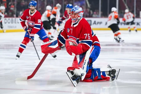 Nov 4, 2025; Montreal, Quebec, CAN; Montreal Canadiens goalie Jakub Dobes (75) stretches during warm-up before the game against the Philadelphia Flyers at Bell Centre.
