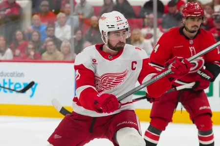 Feb 28, 2026; Raleigh, North Carolina, USA; Detroit Red Wings center Dylan Larkin (71) takes a shot against the Carolina Hurricanes during the second period at Lenovo Center. Feb 28, 2026; Raleigh, North Carolina, USA; Detroit Red Wings center Dylan Larkin (71) takes a shot against the Carolina Hurricanes during the second period at Lenovo Center.