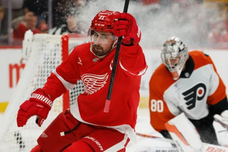Mar 28, 2026; Detroit, Michigan, USA; Detroit Red Wings center Dylan Larkin (71) celebrates after scoring on Philadelphia Flyers goaltender Dan Vladar (80) in the second period at Little Caesars Arena.