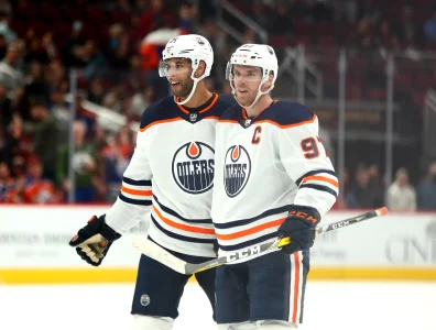 Oct 21, 2021; Glendale, Arizona, USA; Edmonton Oilers center Connor McDavid (97) and defenseman Darnell Nurse (25) against the Arizona Coyotes at Gila River Arena.