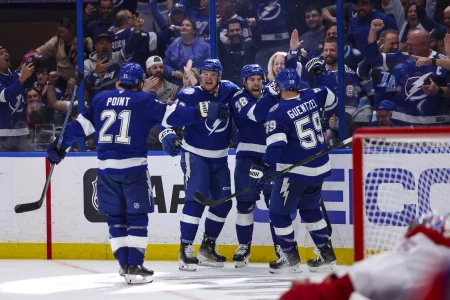 Apr 19, 2026; Tampa, Florida, USA; Tampa Bay Lightning forward Brandon Hagel (38) celebrates his goal with forward Brayden Point (21), defenseman Darren Raddysh (43), and forward Jake Guentzel (59) during the third period in game one of the first round of the 2026 Stanley Cup Playoffs at Benchmark International Arena.