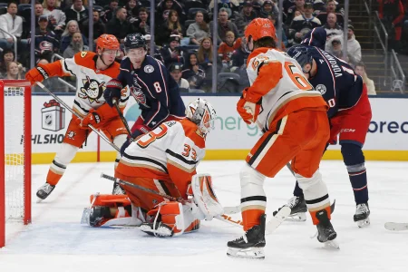 Dec 16, 2025; Columbus, Ohio, USA; Anaheim Ducks goalie Ville Husso (33) makes a save as Columbus Blue Jackets defenseman Zach Werenski (8) looks for a rebound during the second period at Nationwide Arena. : Dec 16, 2025; Columbus, Ohio, USA; Anaheim Ducks goalie Ville Husso (33) makes a save as Columbus Blue Jackets defenseman Zach Werenski (8) looks for a rebound during the second period at Nationwide Arena. :