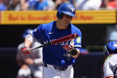 Jun 28, 2026; Toronto, Ontario, CAN; Toronto Blue Jays center fielder Daulton Varsho (5) reacts after striking out during the first inning with men on base against the Texas Rangers at Rogers Centre.