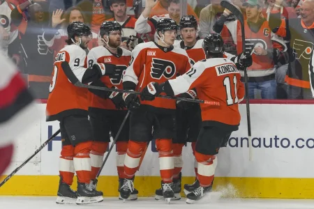 May 9, 2026; Philadelphia, Pennsylvania, USA; Philadelphia Flyers left wing Alex Bump (20) celebrates a goal teammates against the Carolina Hurricanes in game four of the second round of the 2026 Stanely Cup Playoffs at Xfinity Mobile Arena.