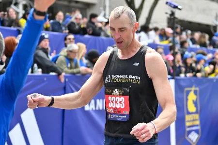 Apr 20, 2026; Boston, MA, USA; NHL Champion Zdeno Chara crosses the finish line at the 130th running of the Boston Marathon. Mandatory Credit: Eric Canha-Imagn Images