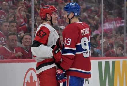 May 25, 2026; Montreal, Quebec, CAN; Carolina Hurricanes right wing Jackson Blake (53) and Montreal Canadiens right wing Ivan Demidov (93) react after a play during overtime in game three of the Eastern Conference Final of the 2026 Stanley Cup Playoffs at Bell Centre.