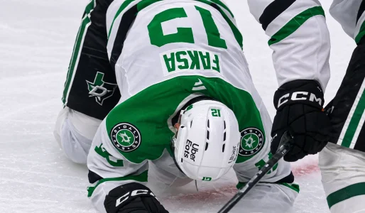 Radek Faksa helped off the ice after being hit by a shot in Pittsburgh