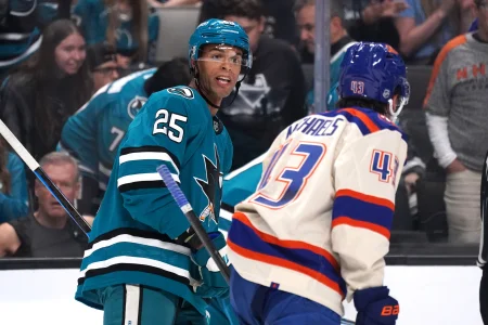 Oct 10, 2026; San Jose, California, USA; San Jose Sharks defenseman Darnell Nurse (25) and Edmonton Oilers right wing Owen Michaels (43) exchange words during a break in the action in the first period at SAP Center in San Jose.