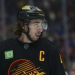 Nov 23, 2025; Vancouver, British Columbia, CAN; Vancouver Canucks defenseman Quinn Hughes (43) looks on during the second period against the Calgary Flames at Rogers Arena.