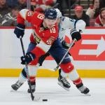 Jan 27, 2026; Sunrise, Florida, USA; Florida Panthers left wing Matthew Tkachuk (19) moves the puck against Utah Mammoth defenseman John Marino (6) during the third period at Amerant Bank Arena.