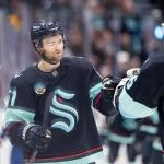 Jan 29, 2026; Seattle, Washington, USA; Seattle Kraken forward Shane Wright (51) celebrates a goal wiht Seattle Kraken goalie Joey Daccord (35) during the third period against the Toronto Maple Leafs at Climate Pledge Arena.