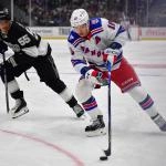 Jan 20, 2026; Los Angeles, California, USA; New York Rangers left wing Artemi Panarin (10) moves the puck against Los Angeles Kings right wing Quinton Byfield (55) during the third period at Crypto.com Arena.