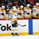 Feb 5, 2026; Washington, District of Columbia, USA; Nashville Predators center Jonathan Marchessault (81) is congratulated by teammates after scoring a goal against the Washington Capitals during the second period at Capital One Arena.