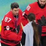 Feb 22, 2026; Milan, Italy; Sidney Crosby of Canada receives his silver medal in the men\'s ice hockey gold medal game during the Milano Cortina 2026 Olympic Winter Games at Milano Santagiulia Ice Hockey Arena. Mandatory Credit: James Lang-Imagn Images