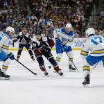 Dec 31, 2025; Denver, Colorado, USA; Colorado Avalanche center Martin Necas (88) controls the puck against St. Louis Blues center Robert Thomas (18) and defenseman Cam Fowler (17) as left wing Pavel Buchnevich (89) looks on in the second period at Ball Arena. Mandatory Credit: Isaiah J. Downing-Imagn Images