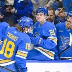 Jan 3, 2026; St. Louis, Missouri, USA; St. Louis Blues center Robert Thomas (18) is congratulated by left wing Jake Neighbours (63) right wing Jimmy Snuggerud (21) and right wing Mathieu Joseph (71) after scoring a shorthanded goal against the Montreal Canadiens during the second period at Enterprise Center. Mandatory Credit: Jeff Curry-Imagn Images