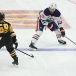Dec 16, 2025; Pittsburgh, Pennsylvania, USA; Edmonton Oilers center Adam Henrique (19) skates up ice with the puck as Pittsburgh Penguins defenseman Kris Letang (58) defends during the third period at PPG Paints Arena.