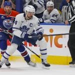 Feb 3, 2026; Edmonton, Alberta, CAN; Toronto Maple Leafs forward Auston Matthews (34) and Edmonton Oilers forward Connor McDavid (97) chase a loose puck during the first period at Rogers Place