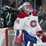 Mar 3, 2026; San Jose, California, USA; Montreal Canadiens goaltender Jakub Dobes (75) watches the big screen as the San Jose Sharks celebrate behind him during the second period at SAP Center at San Jose.