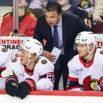 Mar 5, 2026; Calgary, Alberta, CAN; Ottawa Senators head coach Travis Green on his bench during the first period against the Calgary Flames at Scotiabank Saddledome.