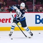 Dec 3, 2025; Montreal, Quebec, CAN; Winnipeg Jets center Cole Perfetti (91) shoots during warm-ups before a game against the Montreal Canadiens at Bell Centre. Mandatory Credit: David Kirouac-Imagn Images