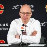 Jan 21, 2026; Calgary, Alberta, CAN; Calgary Flames head coach Ryan Huska during interview after the game between the Calgary Flames and the Pittsburgh Penguins at Scotiabank Saddledome.