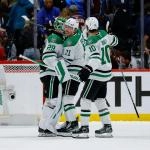 Mar 18, 2026; Denver, Colorado, USA; Dallas Stars goaltender Jake Oettinger (29) celebrates with left wing Jason Robertson (21) and center Oskar Back (10) after the game against the Colorado Avalanche at Ball Arena.