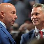 Jul 7, 2022; Montreal, Quebec, CANADA; Montreal Canadiens general manager Kent Hughes (left) talks with head coach Martin St. Louis before the first round of the 2022 NHL Draft at Bell Centre. Mandatory Credit: Eric Bolte-Imagn Images