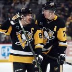 Nov 27, 2024; Pittsburgh, Pennsylvania, USA; Pittsburgh Penguins center Sidney Crosby (87) and center Evgeni Malkin (71) talk before a face-off against the Vancouver Canucks during the third period at PPG Paints Arena. Mandatory Credit: Charles LeClaire-Imagn Images