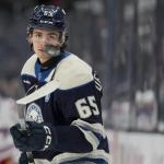 Feb 8, 2025; Columbus, Ohio, USA; Columbus Blue Jackets center Luca Del Bel Belluz (65) juggles a puck with his stick during warmups before the game against the New York Rangers at Nationwide Arena.