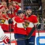Dec 29, 2025; Sunrise, Florida, USA; Florida Panthers left wing Brad Marchand (63) and center Sam Bennett (9) celebrate his goal against the Washington Capitals during the third period at Amerant Bank Arena. Mandatory Credit: Jeff Romance-Imagn Images