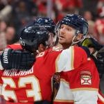 Dec 20, 2025; Sunrise, Florida, USA; Florida Panthers center Sam Reinhart (13) celebrates with left wing Brad Marchand (63) and center Sam Bennett (9) after scoring against the St. Louis Blues during the second period at Amerant Bank Arena. Mandatory Credit: Sam Navarro-Imagn Images