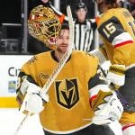 Mar 28, 2026; Las Vegas, Nevada, USA; Vegas Golden Knights goaltender Adin Hill (33) flips his helmet off after a Washington Capitals shot breaks one of the straps during an overtime period at T-Mobile Arena. Mandatory Credit: Stephen R. Sylvanie-Imagn Images