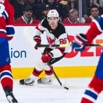 Apr 5, 2026; Montreal, Quebec, CAN; New Jersey Devils center Jack Hughes (86) plays the puck against the Montreal Canadiens during the second period at Bell Centre. Mandatory Credit: David Kirouac-Imagn Images