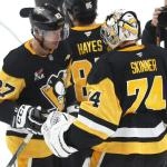 Mar 31, 2026; Pittsburgh, Pennsylvania, USA; Pittsburgh Penguins center Sidney Crosby (87) and goaltender Stuart Skinner (74) celebrate after defeating the Detroit Red Wings at PPG Paints Arena. Mandatory Credit: Charles LeClaire-Imagn Images
