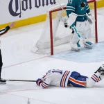 Apr 8, 2026; San Jose, California, USA; Edmonton Oilers center Jason Dickinson (16) falls to the ice injured against the San Jose Sharks in the third period at SAP Center at San Jose. Mandatory Credit: David Gonzales-Imagn Images