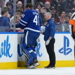 Apr 8, 2026; Toronto, Ontario, CAN; Toronto Maple Leafs goaltender Anthony Stolarz (41) is escorted off the ice after an apparent injury against the Washington Capitals during the first period at Scotiabank Arena. Mandatory Credit: Nick Turchiaro-Imagn Images