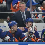 Jan 21, 2024; Elmont, New York, USA; New York Islanders head coach Patrick Roy talks to right wing Cal Clutterbuck (15) and center Mathew Barzal (13) during the first period against the Dallas Stars at UBS Arena. Mandatory Credit: Brad Penner-Imagn Images