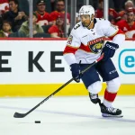 Mar 20, 2026; Calgary, Alberta, CAN; Florida Panthers defenseman Seth Jones (3) skates with the puck against the Calgary Flames during the third period at Scotiabank Saddledome.
