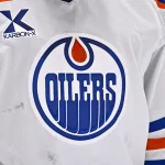 May 29, 2025; Dallas, Texas, USA; A view of the logo of the Edmonton Oilers on the jersey of goaltender Stuart Skinner (74) during the game between the Dallas Stars and the Edmonton Oilers in game five of the Western Conference Final of the 2025 Stanley Cup Playoffs at American Airlines Center. Mandatory Credit: Jerome Miron-Imagn Images