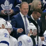 Dec 8, 2025; Toronto, Ontario, CAN; Tampa Bay Lightning head coach Jon Cooper talks to his players during a break in the action against the Toronto Maple Leafs at Scotiabank Arena.