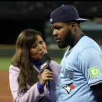 Oct 16, 2025; Seattle, Washington, USA; Toronto Blue Jays first baseman Vladimir Guerrero Jr. (27) is interviewed after winning game four of the ALCS round for the 2025 MLB playoffs against the Seattle Mariners at T-Mobile Park. Mandatory Credit: Kevin Ng-Imagn Images