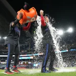Jul 24, 2024; Toronto, Ontario, CAN; Toronto Blue Jays first basema Vladimir Guerrero Jr. (27) pours water on designated hitter Justin Turner (2) after a game against the Tampa Bay Rays at Rogers Centre.