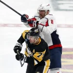 Jan 2, 2024; Pittsburgh, Pennsylvania, USA; Washington Capitals left wing Alex Ovechkin (8) checks Pittsburgh Penguins center Evgeni Malkin (71) during the third period at PPG Paints Arena. Mandatory Credit: Charles LeClaire-Imagn Images