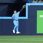 Apr 11, 2026; Toronto, Ontario, CAN; Toronto Blue Jays center fielder Daulton Varsho (5) is unable to catch a fly ball against the Minnesota Twins during the third inning at Rogers Centre.