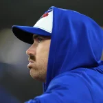 Oct 12, 2025; Toronto, Ontario, CAN; Toronto Blue Jays pitcher Shane Bieber (57) looks on from the dugout in the sixth inning against the Seattle Mariners during game one of the ALCS round for the 2025 MLB playoffs at Rogers Centre. Mandatory Credit: John E. Sokolowski-Imagn Images