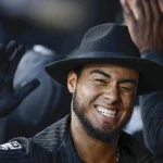 Aug 25, 2023; Chicago, Illinois, USA; Chicago White Sox second baseman Lenyn Sosa (50) celebrates in the dugout after hitting a two-run home run against the Oakland Athletics during the second inning at Guaranteed Rate Field. Mandatory Credit: Kamil Krzaczynski-Imagn Images